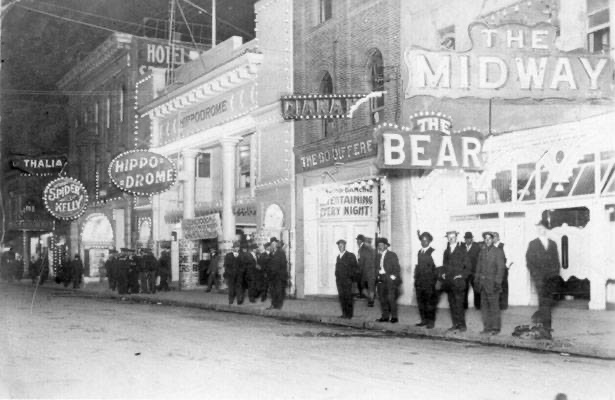 Night on the Barbary Coast — the Hippodrome and neighboring dance halls lit up along Pacific Street